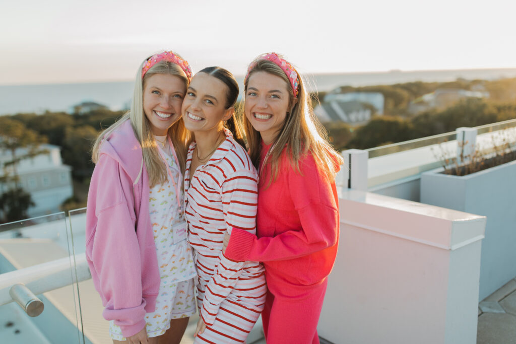 Women smiling and hugging each other